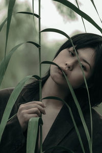 Portrait of woman with plants