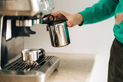 Man and coffee cup at home