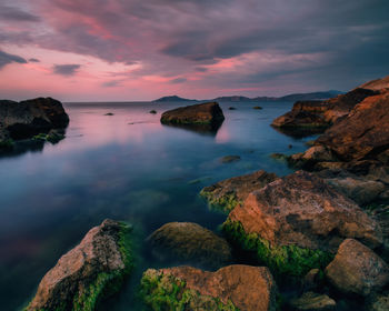 Scenic view of sea against sky at sunset