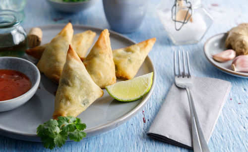High angle view of fruits in plate on table