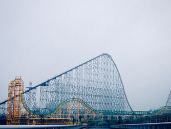 Roller coaster on the side of the express way in japan.