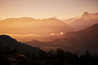 Scenic view of mountains against sky during sunset