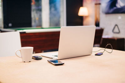 Close-up of coffee cup on table