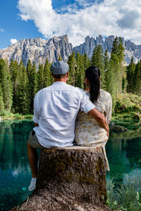 Rear view of people looking at mountains