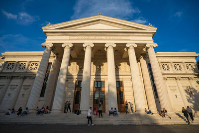 Group of people in front of historical building