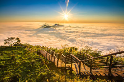 The stairs above the clouds during sunset