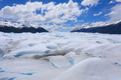 Scenic view of snowcapped landscape against sky