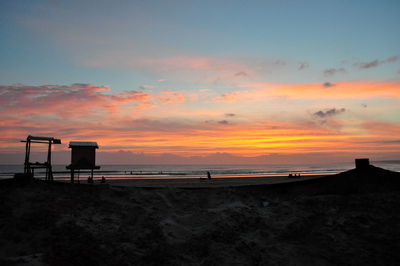 Scenic view of beach against sky during sunset