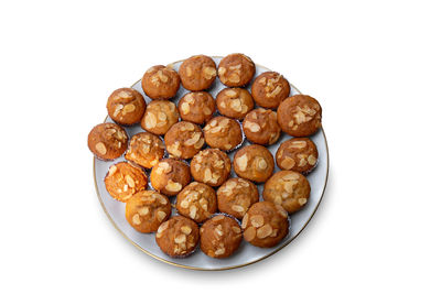 Close-up of roasted coffee beans against white background