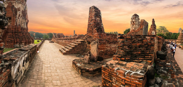 Panoramic view of old building against sky during sunset