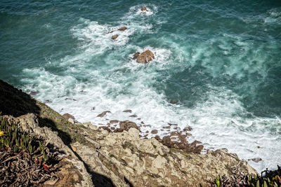 High angle view of rocks in sea