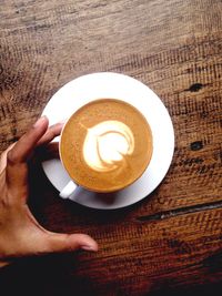 High angle view of coffee cup on table