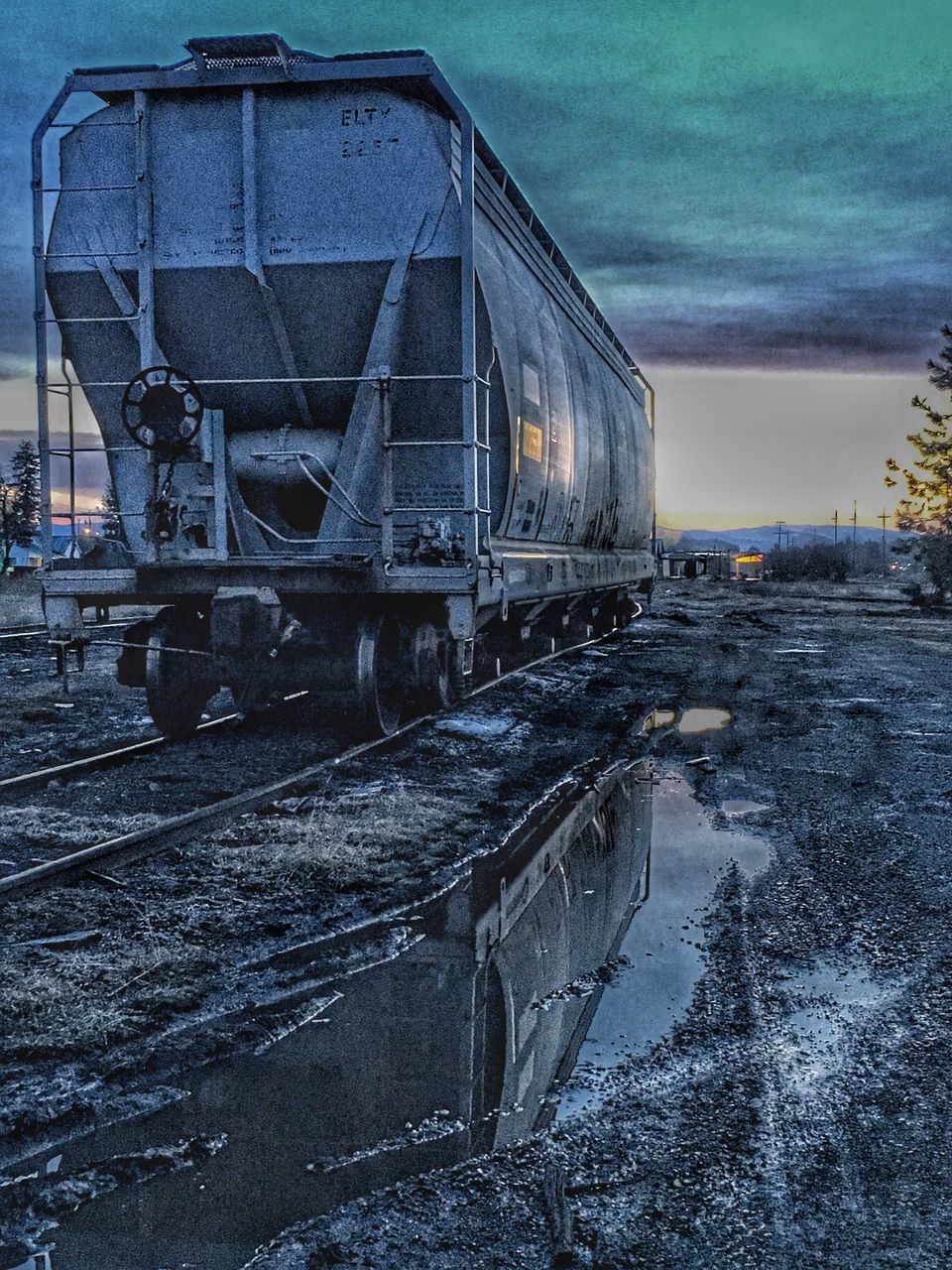 TRAIN ON SNOW COVERED RAILROAD TRACK