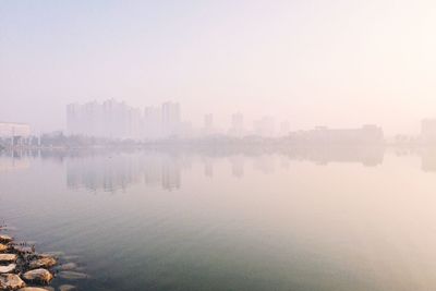 View of river in city at dusk