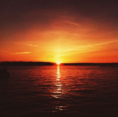 sunset, water, tranquil scene, scenics, orange color, tranquility, reflection, beauty in nature, waterfront, sky, sun, idyllic, nature, silhouette, lake, rippled, sea, cloud - sky, outdoors, no people