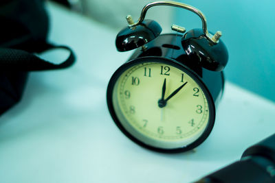 Close-up of clock on table