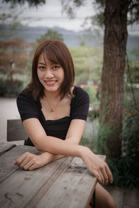 Portrait of young woman reading book