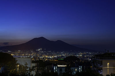 High angle view of illuminated buildings in city at night