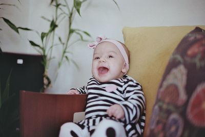 Portrait of cute baby boy at home