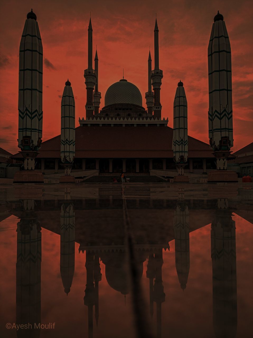 architecture, reflection, place of worship, religion, evening, built structure, travel destinations, sunset, sky, water, travel, building exterior, dome, dusk, belief, landmark, nature, city, temple, spirituality, night, tourism, twilight, building, cloud, history, outdoors, the past, praying