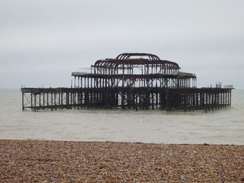 Pier on sea against sky