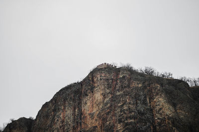 Low angle view of rock formation against clear sky