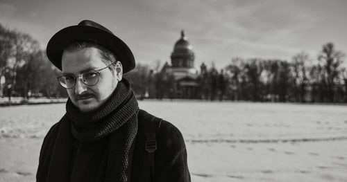 Portrait of young man standing in winter