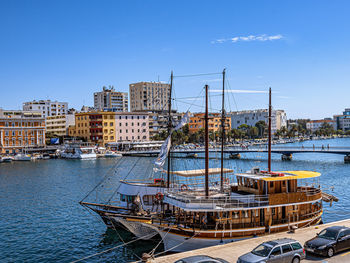 Boats in sea against sky