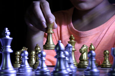 Low angle view of man playing with chess