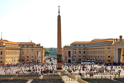 People at town square against clear sky