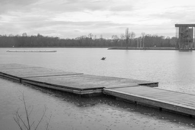 Scenic view of lake against sky during winter