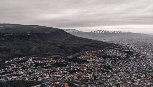 Aerial view of townscape against sky