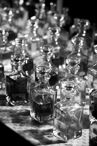 Athar,close-up of glass bottles on table