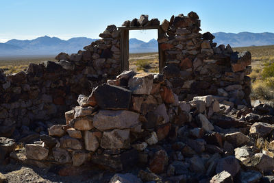 Stack of old ruins against sky