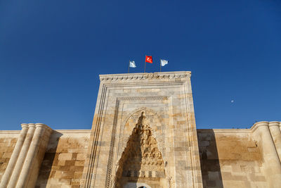 Low angle view of historical building against blue sky