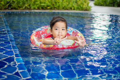 Portrait of girl swimming in pool