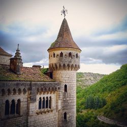 Low angle view of castle against cloudy sky