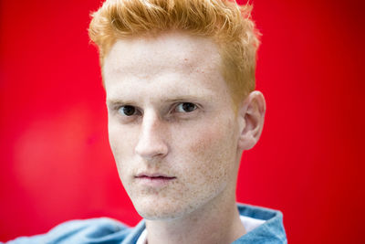 Close-up portrait of a serious young man