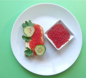 High angle view of strawberries in plate on table