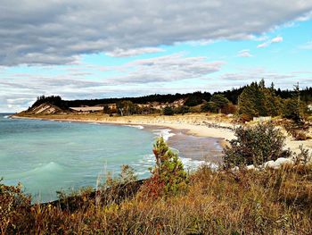 Scenic view of sea against cloudy sky