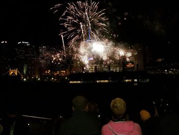 View of firework display at night