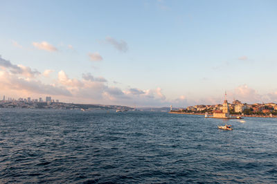 Distance view of maiden tower in sea against sky