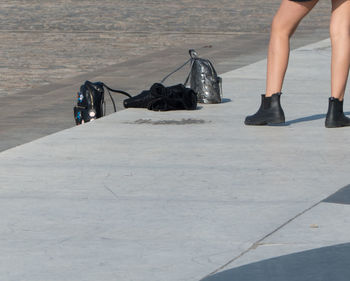 Low section of woman dancing on street