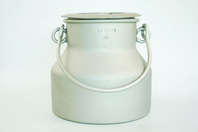 Close-up of coffee cup on table against white background