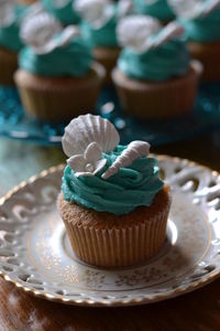 Close-up of cupcakes in plate on table