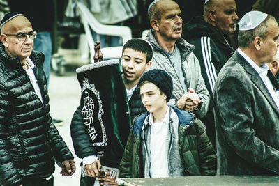 Group of people looking away outdoors