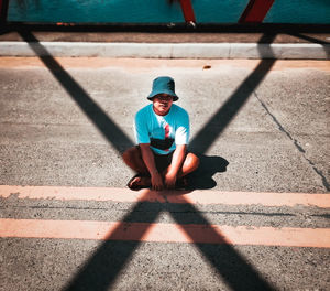 Low section of man walking on street