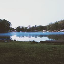 Scenic view of calm lake against clear sky