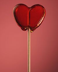 Close-up of heart shape against pink background