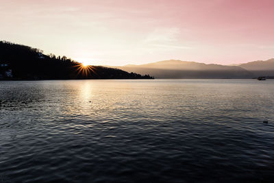 Scenic view of lake against sky during sunset